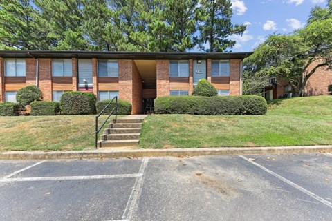 a large brick building with stairs in front of it
